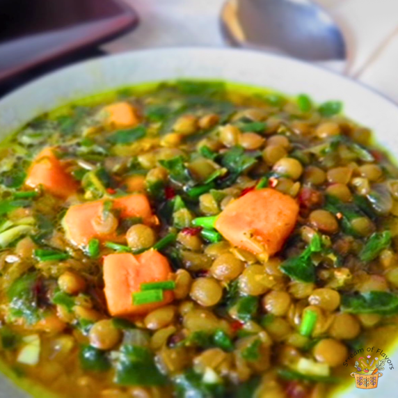 Swiss Chard Soup with brown lentils and sweet potatoes in a white bowl