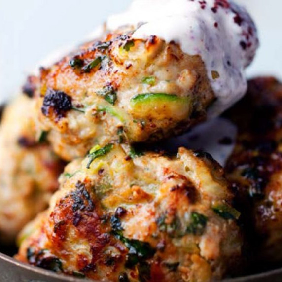 Turkey burgers with Sumac sauce in a small bowl