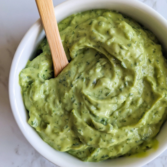 A bowl of bright green avocado crema