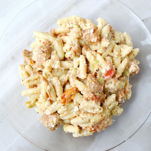 Cheesy baked feta pasta mixed together with crushed grape tomatoes, zucchini, and chicken sausage