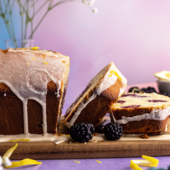 Blackberry lemon bread slices on a wooden board