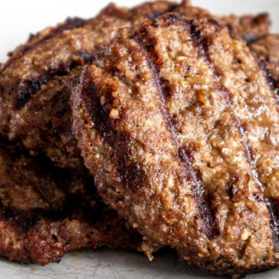 Cooked burger patties on a plate. 