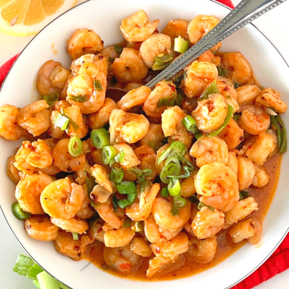 chili garlic butter shrimp on plate