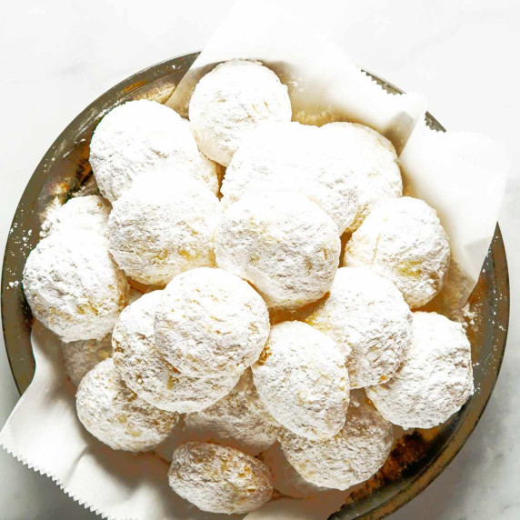 mexican wedding cookies or Danish wedding cookies in a wooden bowl.