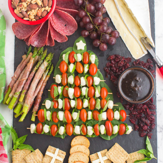 a charcuterie board laid out in shape of a Christmas tree