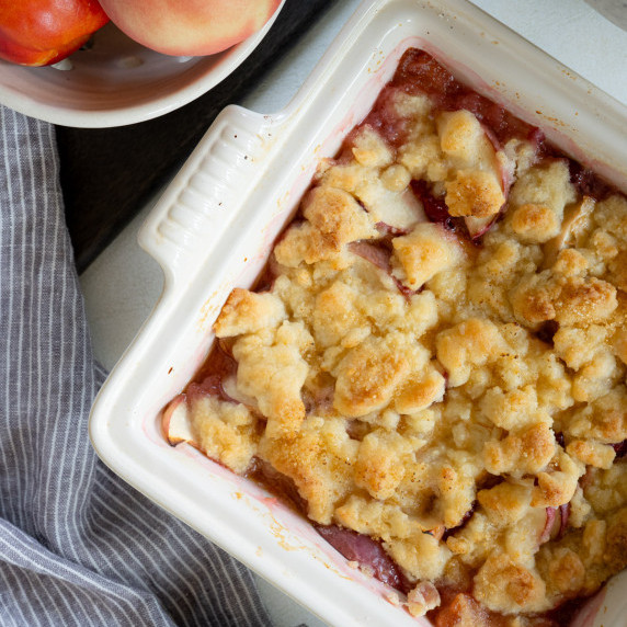 A peach cobbler in a baking dish.