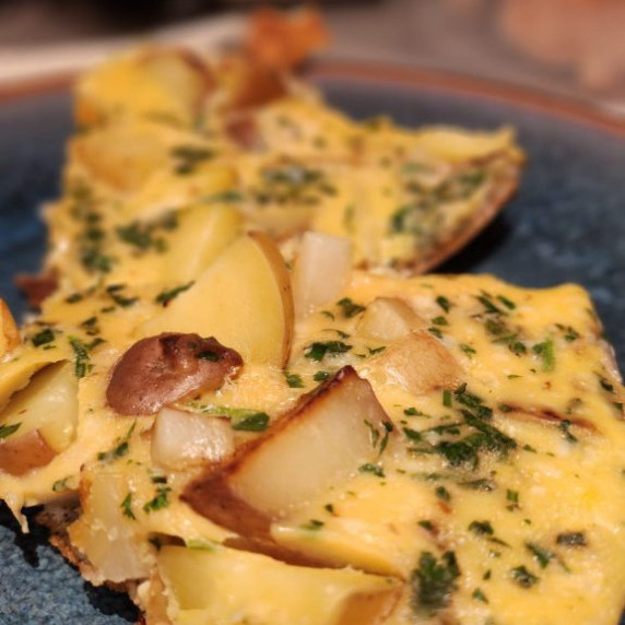 Frittata served on a blue plate 