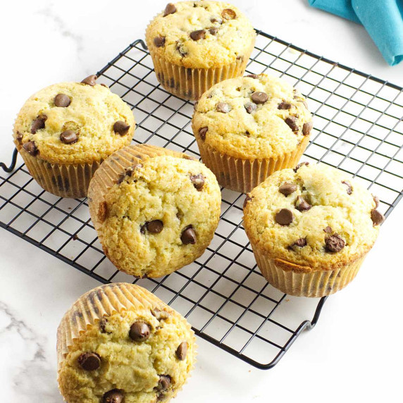 cooling rack with jumbo chocolate chip muffins on it.