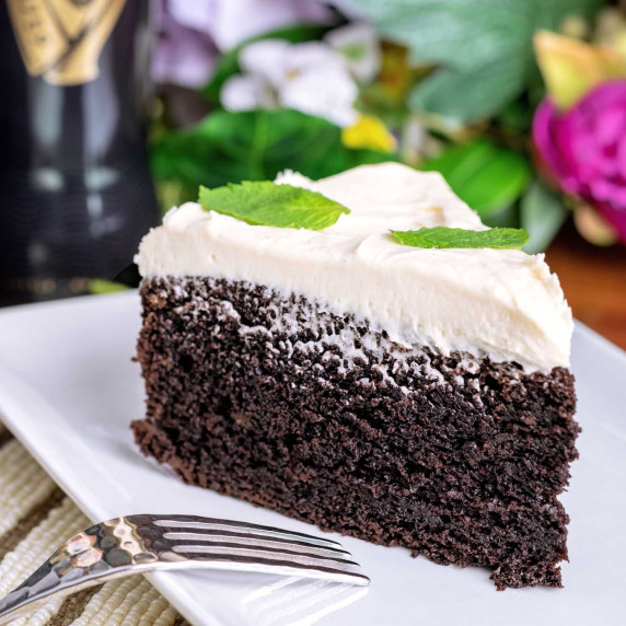 A slice of Guinness Chocolate Cake with Bailey's Irish Cream Frosting on a plate.