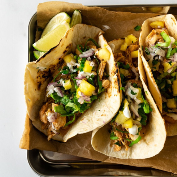 tacos on a baking sheet with parchment paper.