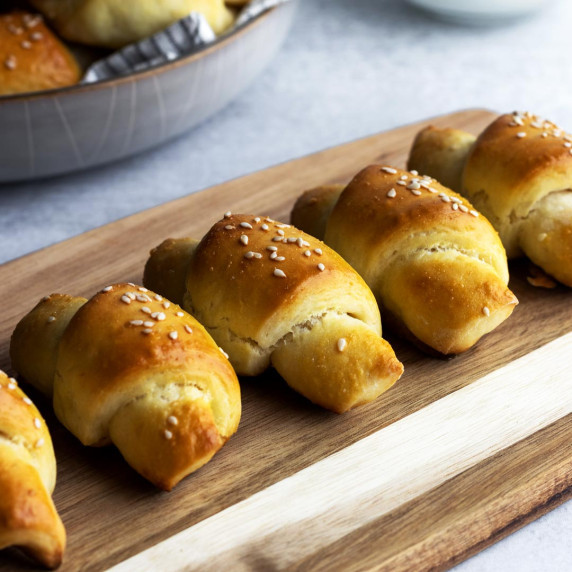 Homemade crescent rolls on a cutting board