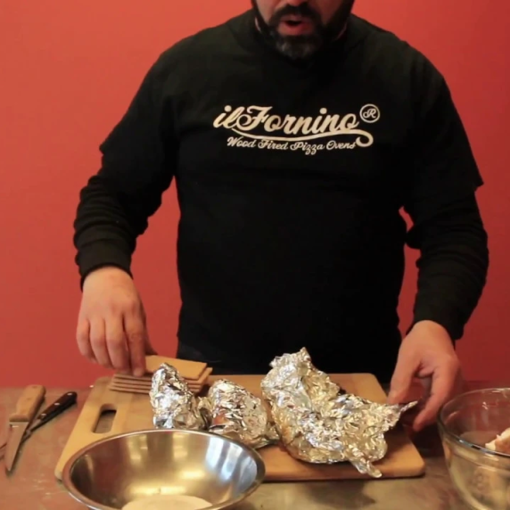 Banana chocolate dessert cooking inside a traditional wood fired oven