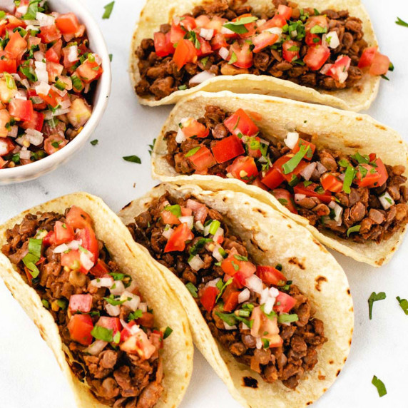 Lentil walnut taco meat in corn taco shells with pico de Gallo.
