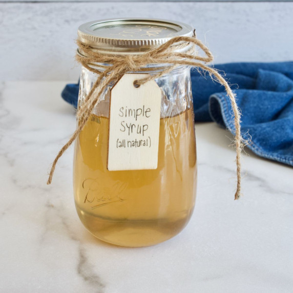 A pretty jar of golden liquid, filled with simple syrup made with all natural cane sugar. 