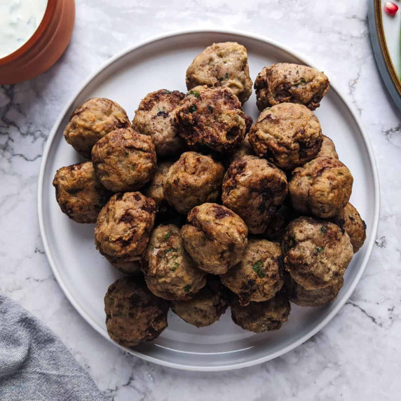 Keftedakia meatballs served on a white plate
