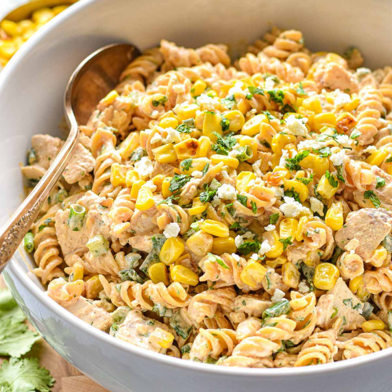 mexican street corn pasta salad in a white serving bowl.