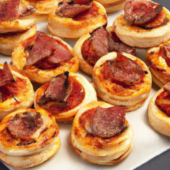 mini party pizzas made with puff pastry and salami sticks