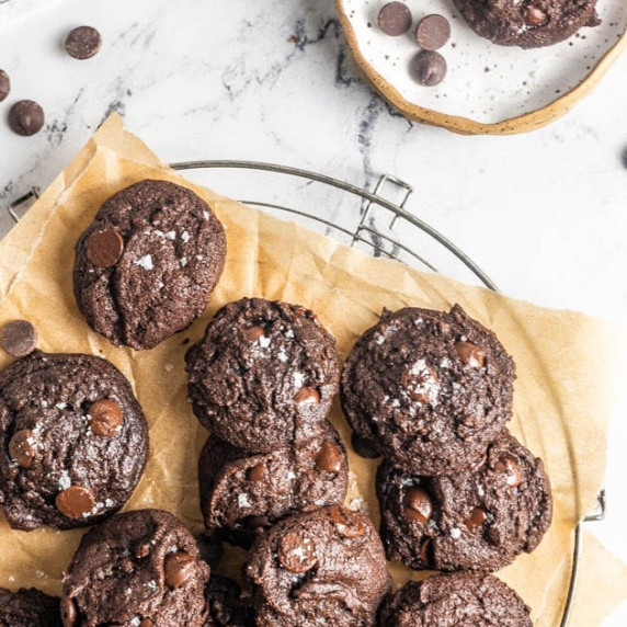 chocolate chip oat flour cookies on top of a cooling rack
