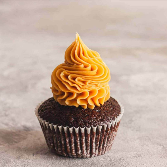 Peanut butter ganache on a chocolate cupcake.