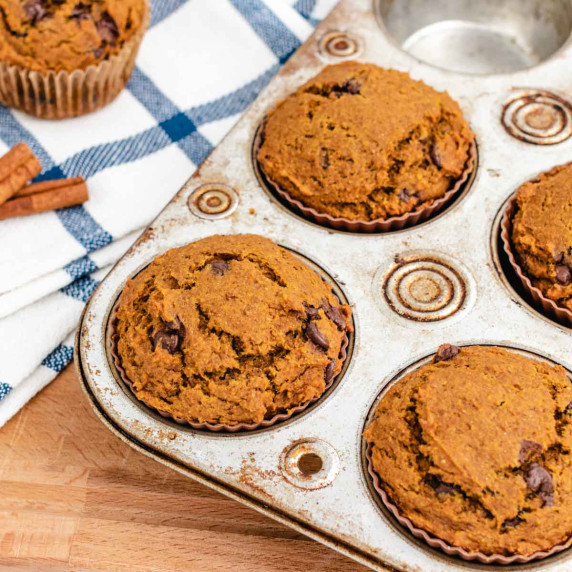 Pumpkin peanut butter muffins in a muffin tray.