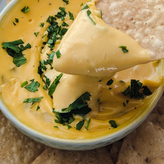 green chili queso in a small bowl 