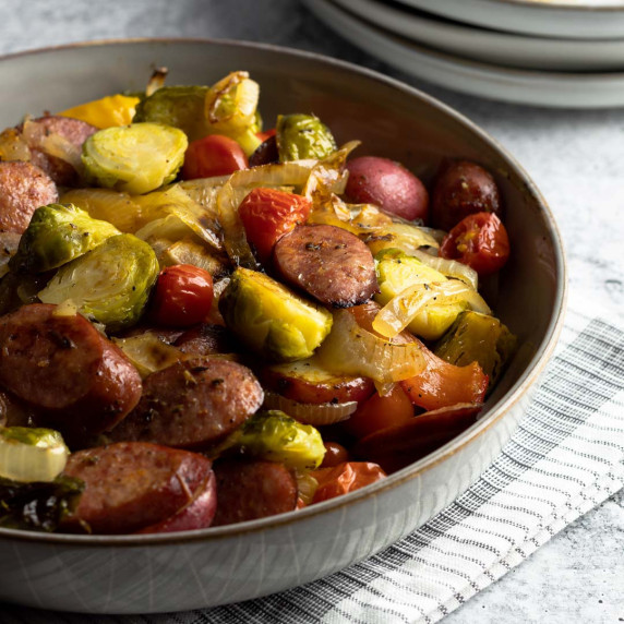 Sheet pan sausage and veggies in a bowl