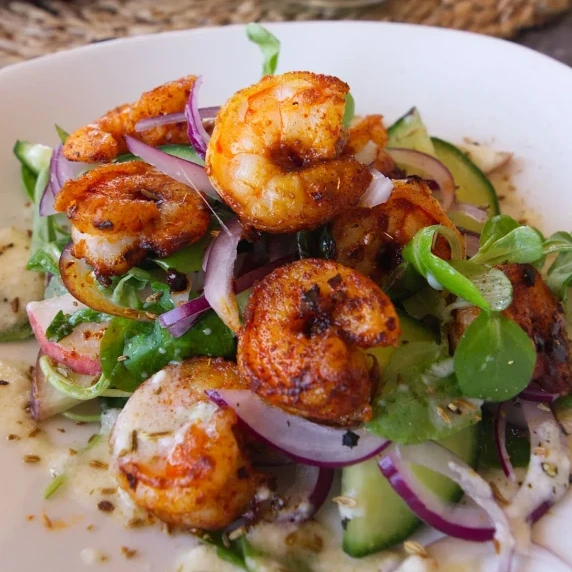 A spicy shrimp salad with peaches and a tangy dressing. 