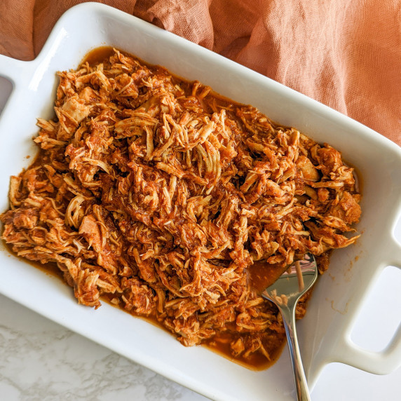 A serving dish of shredded Mexican chicken tinga