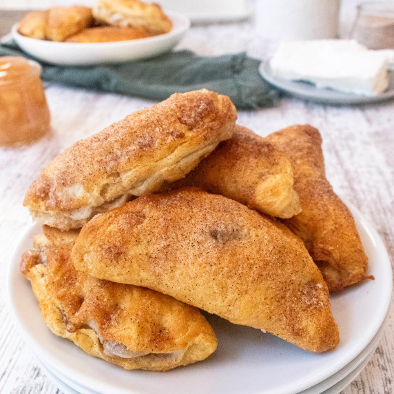 Cinnamon Sugar apple pie turnover on a white plate