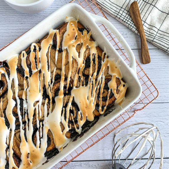 top view of white pan of s'mores sweet rolls on a white wood countertop