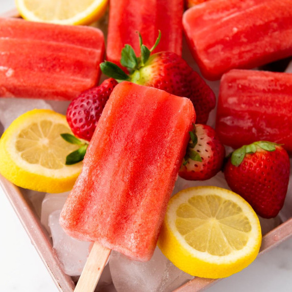 Vegan Strawberry Lemon Popsicles in a tray on the table