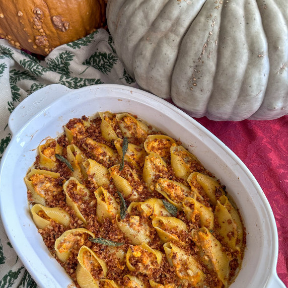 Pumpkin stuffed jumbo shells covered in sage cream with toasted bread crumbs and fried sage leaves
