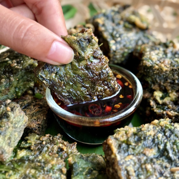 Thai Thai chive pancake dipped in sauce.