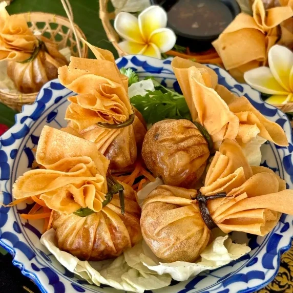 Thai money bags with sweet chili sauce. 