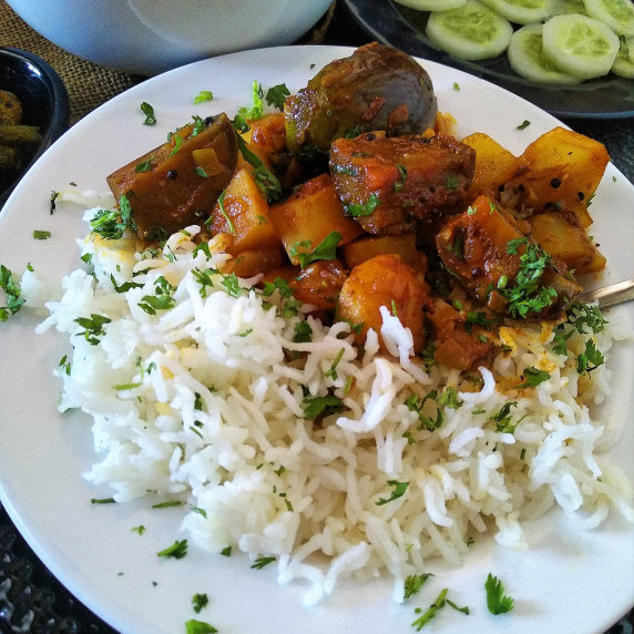 An everyday curry made with eggplants & potato simmered with aromatic spices. A vegan curry recipe.