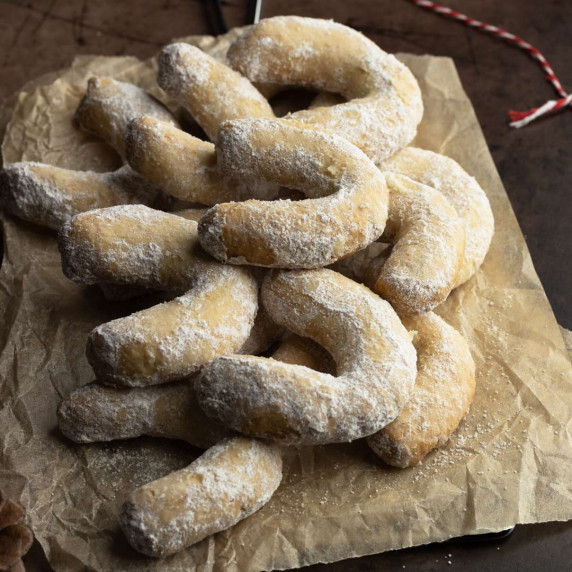 Vanilla crescent cookies on a parchment paper