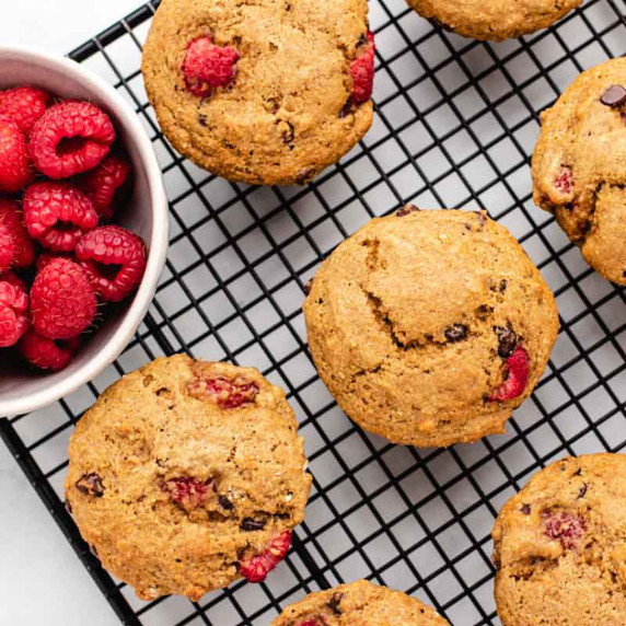 Vegan oil-free raspberry muffins on a cooling rack.
