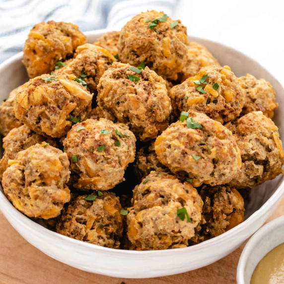 Vegan sausage balls in a white bowl.